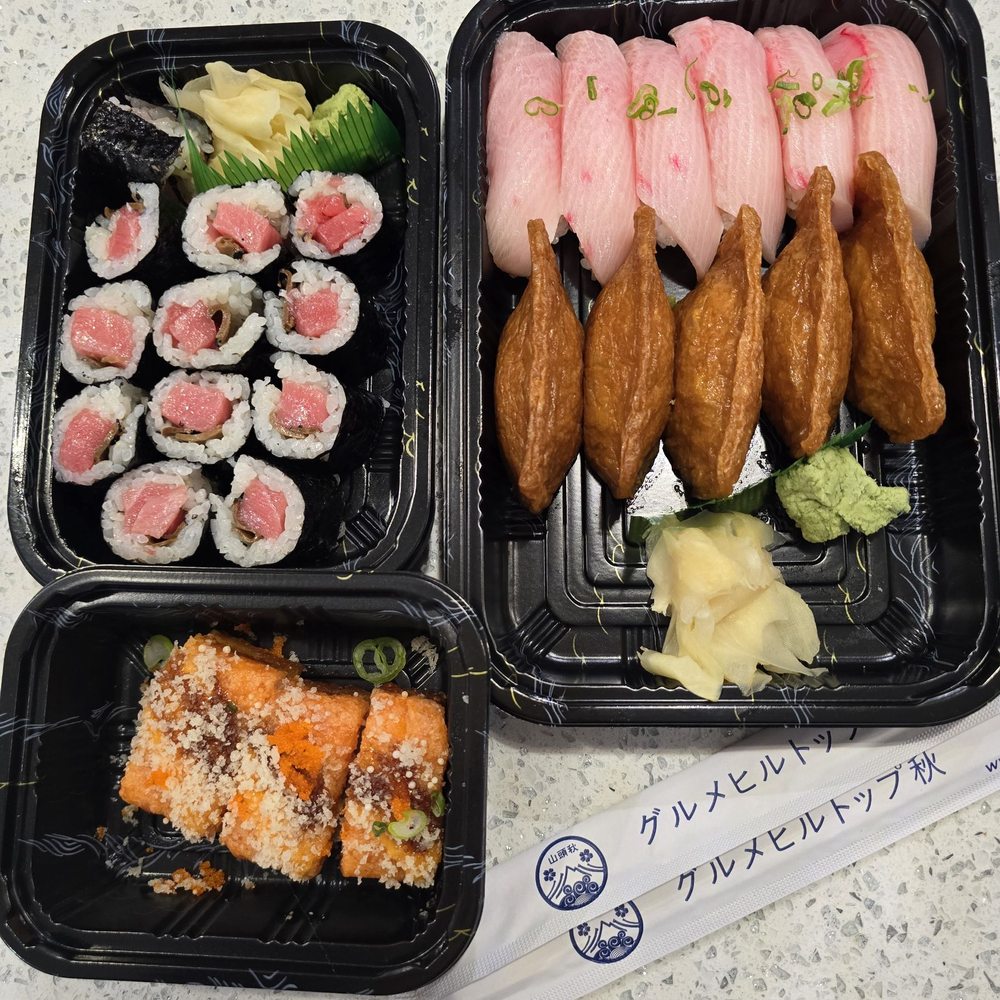 Toro truffle rolls, yellow tail, inari (tofu skin), and spicy salmon crispy rice