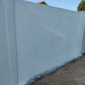 Construction Alliance Group - Paint complete after rebuilding block wall and applying stucco - General Contractors Near Me