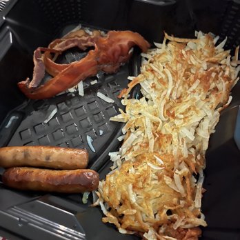 Denny's - bacon, hash browns, and sausages in a container - American Near Me - Tooele, Utah