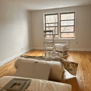 Calianese Painting - a living room with hard wood floors - Painters Near Me