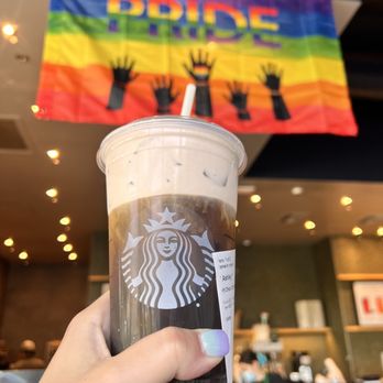 Starbucks - a person holding a cup of coffee - Coffee & Tea Near Me - Chula Vista, California Starbucks - a person holding a cup of coffee - Coffee & Tea Near Me - Chula Vista, California