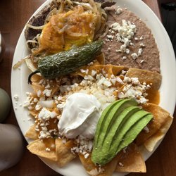 Mexico Lindo - Chilaquiles rojo with steak and eggs very delicious