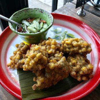 Khao Nom - Thai Corn Fritter- Sweet corn, black pepper, garlic, cilantro, rice flour served with cucumber ah-jad sauce - Desserts Near Me - Elmhurst, New York