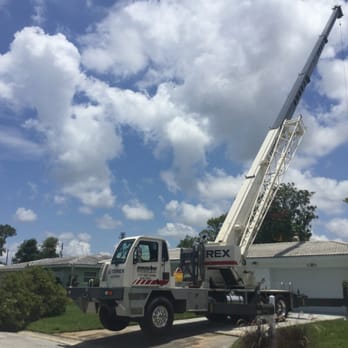Acorn Tree Service - Crane used to remove tree sections. - Tree Services Near Me - Clearwater, Florida