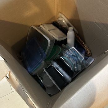 Honolulu Movers - The mess of packing just piled high in a garment box - Movers Near Me Honolulu Movers - The mess of packing just piled high in a garment box - Movers Near Me