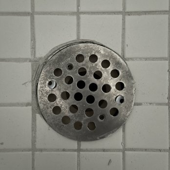 Ramey Floor & Home - Tile not cut to align with drain. - Flooring Near Me - Stuart, Florida