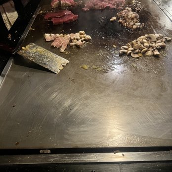Shogun Japanese Steakhouse Naperville - a man cooking steaks - Steakhouses Near Me - Naperville, Illinois Shogun Japanese Steakhouse Naperville - a man cooking steaks - Steakhouses Near Me - Naperville, Illinois