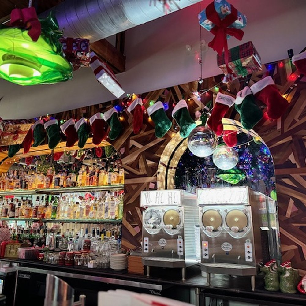 Winnie's - Bar area with socks hung. - Cocktail Bars Near Me - Houston, Texas Winnie's - Bar area with socks hung. - Cocktail Bars Near Me - Houston, Texas