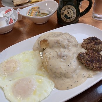 Another Broken Egg Cafe - Sausage gravy with sausage patty's and over easy eggs. Fresh brewed Rwandan blend coffee - Breakfast & Brunch Near Me - Clearwater Beach, Florida