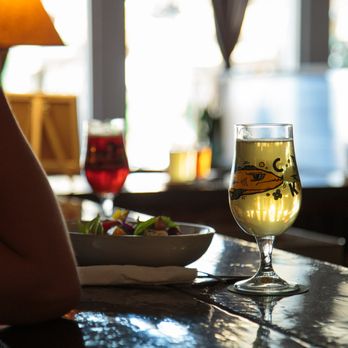 Kettle River Brewing - a glass of beer and a plate of salad - Breweries Near Me - Kelowna, British Columbia Kettle River Brewing - a glass of beer and a plate of salad - Breweries Near Me - Kelowna, British Columbia