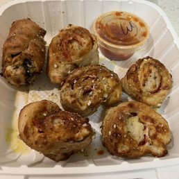 Mostly eaten. One spinach and mushroom pizza roll and pepperoni pizza rolls Mostly eaten. One spinach and mushroom pizza roll and pepperoni pizza rolls
