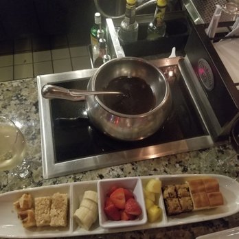 The Melting Pot - Dark chocolate with dippers including waffle, rice crispies treat, banana, strawberry, pineapple, brokie and pound cake. Delicious!! - Fondue Near Me - Savannah, Georgia The Melting Pot - Dark chocolate with dippers including waffle, rice crispies treat, banana, strawberry, pineapple, brokie and pound cake. Delicious!! - Fondue Near Me - Savannah, Georgia