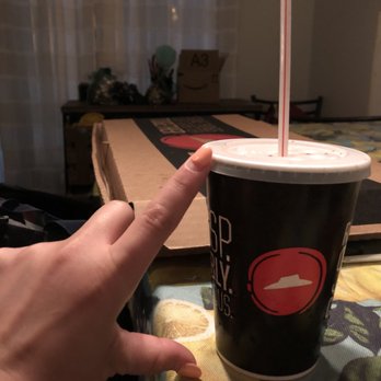 Pizza Hut - a hand holding a cup with a straw - Pizza Near Me - Coachella, California