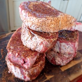 Bob Stark's Beef Shop - a stack of steaks on a cutting board - Meat Shops Near Me - McAllen, Texas