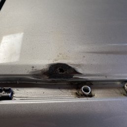The hole that the rust caused after they sanded it down.