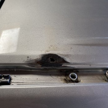 A-1 Rhino Linings - The hole that the rust caused after they sanded it down. - Auto Repair Near Me - Colma, California