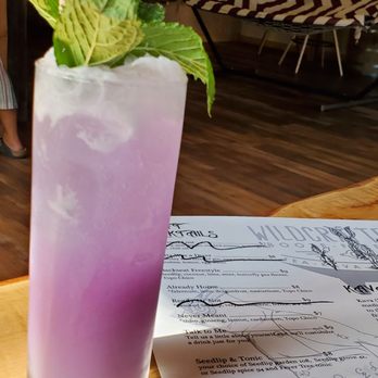 Wildcrafters - This drink is called Backseat Freestyle, Seedlip, coconut, lime, mint, butterfly pea flower, topo chico. - Tea Rooms Near Me - Jacksonville, Florida