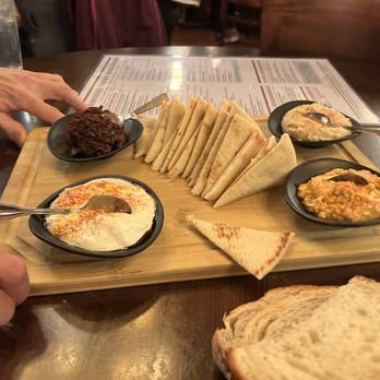 Tablas Woodstone Taverna - Four dip with pita platter - Tapas/Small Plates Near Me - Mill Creek, Washington Tablas Woodstone Taverna - Four dip with pita platter - Tapas/Small Plates Near Me - Mill Creek, Washington