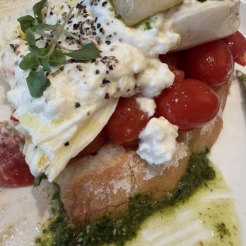 Sixty Vines - BURRATA basil pesto, wood grilled ciabatta, tomato & garlic confit, balsamic dijon vinaigrette, sea salt - New American Near Me - Austin, Texas