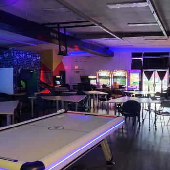 Arcademy - View from the back of the room - lots of tables/chairs, games, big screen tv playing Kung Fu Panda - Arcades Near Me - Kapolei, Hawaii Arcademy - View from the back of the room - lots of tables/chairs, games, big screen tv playing Kung Fu Panda - Arcades Near Me - Kapolei, Hawaii
