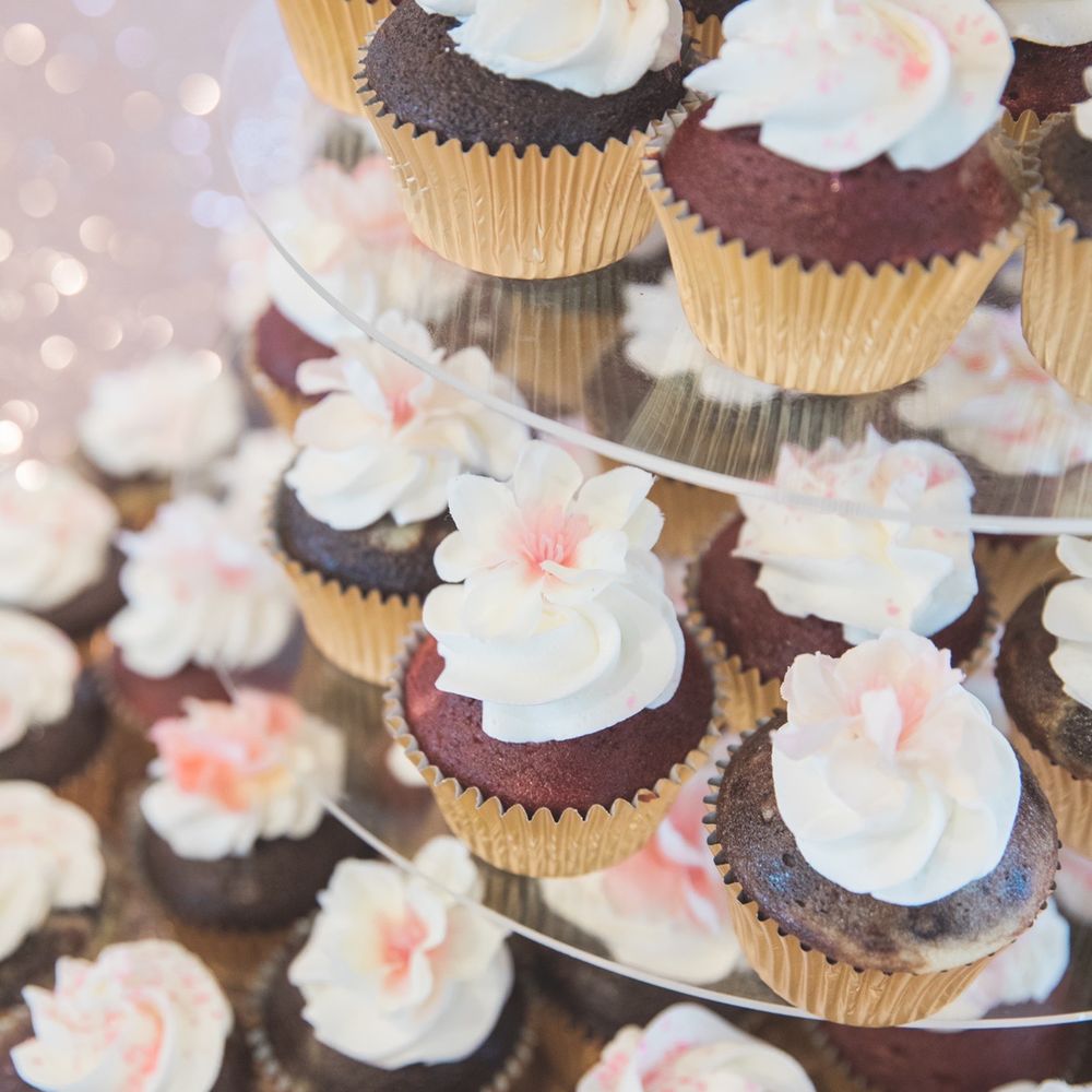 Bev Tanaka - a tower of cupcakes with frosting - Party & Event Planning Near Me Bev Tanaka - a tower of cupcakes with frosting - Party & Event Planning Near Me