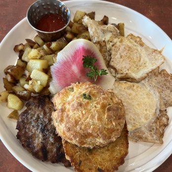 Roses Restaurant - Cheddar/Chive biscuit with house-formed sausage patty, two eggs over medium, watermelon radish, and home fries - Breakfast & Brunch Near Me - Lee, Massachusetts Roses Restaurant - Cheddar/Chive biscuit with house-formed sausage patty, two eggs over medium, watermelon radish, and home fries - Breakfast & Brunch Near Me - Lee, Massachusetts