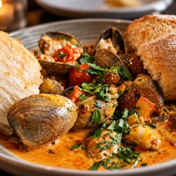 Lewis & Main - Clams with ground Chorizo, crushed red pepper, garlic, fennel, onions, lemon cream broth and grilled toast