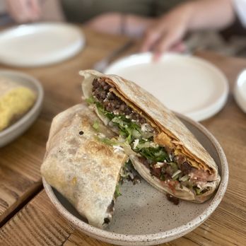 Rascal's Vegan - Asada Crunchwrap: tostada, refried beans, asada, daiya™ cheese, pico de gallo, cashew crema in a flour tortilla. salsa of your choice - Vegan Near Me - Santa Barbara, California Rascal's Vegan - Asada Crunchwrap: tostada, refried beans, asada, daiya™ cheese, pico de gallo, cashew crema in a flour tortilla. salsa of your choice - Vegan Near Me - Santa Barbara, California