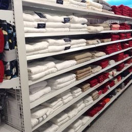 Towels neatly folded, stacked, arranged by color. Towels neatly folded, stacked, arranged by color.