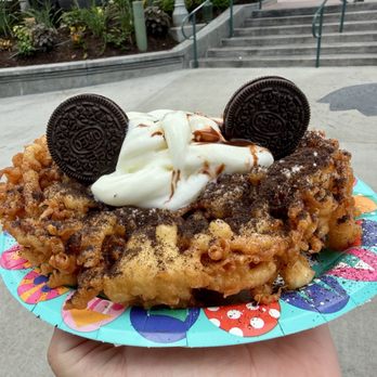Epic Eats - "Cookies & Cream Funnel Cake" (cookies & cream topping, vanilla soft-serve) - Bakeries Near Me - Lake Buena Vista, Florida Epic Eats - "Cookies & Cream Funnel Cake" (cookies & cream topping, vanilla soft-serve) - Bakeries Near Me - Lake Buena Vista, Florida