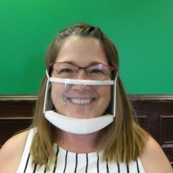 Hear Now Audiology & Tinnitus Center - Our staff wears clear communication masks to help ease communication while staying safe. Here's audiologist Angie wearing hers.