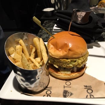 Topgolf - Mac and Cheese Burger!! Well Worth it! Fries were average but burger was great the Mac and Cheese had spice from peppers in it. - New American Near Me - Overland Park, Kansas Topgolf - Mac and Cheese Burger!! Well Worth it! Fries were average but burger was great the Mac and Cheese had spice from peppers in it. - New American Near Me - Overland Park, Kansas
