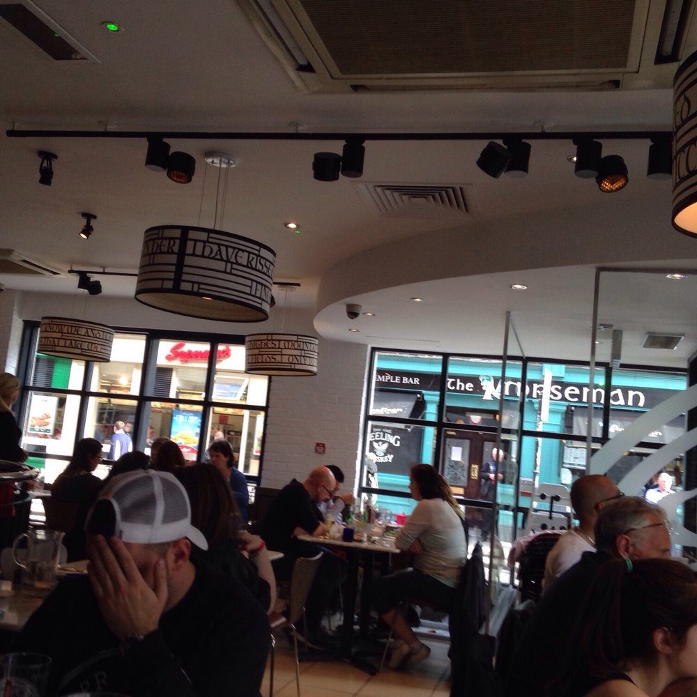 The main eatery (that man in the cap does not like his pizza). The main eatery (that man in the cap does not like his pizza).
