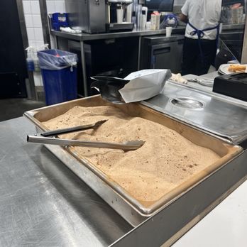 El Moro Churrería - My churro cooked and waiting for my latte. - Desserts Near Me - Costa Mesa, California El Moro Churrería - My churro cooked and waiting for my latte. - Desserts Near Me - Costa Mesa, California