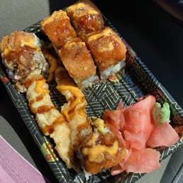 a close up of a tray of sushi