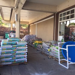 Pukalani Ace Hardware - The front door is surrounded with lots of merchandise for the garden because people Upcountry like to garden