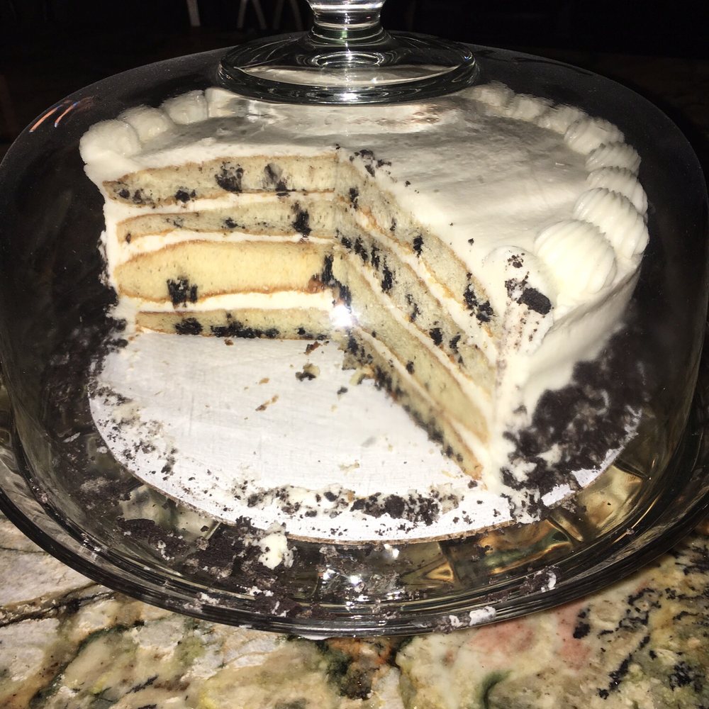 a cake with a slice taken out of it a cake with a slice taken out of it