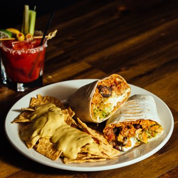 Infinity Room - Haystack Burrito pictured with House Made Bloody Mary. - Music Venues Near Me - Salem, Oregon Infinity Room - Haystack Burrito pictured with House Made Bloody Mary. - Music Venues Near Me - Salem, Oregon