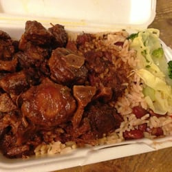 Fish Palace Restaurant - Large takeout order of oxtail with rice and beans