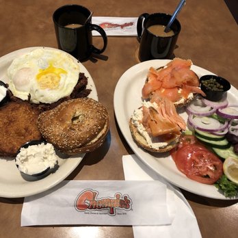 Chompie's - Lox and bagels on right. On the left Corned Beef Hash with two eggs over easy, latke, everything bagel and cream cheese. Yummy! - Delis Near Me - Scottsdale, Arizona Chompie's - Lox and bagels on right. On the left Corned Beef Hash with two eggs over easy, latke, everything bagel and cream cheese. Yummy! - Delis Near Me - Scottsdale, Arizona