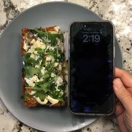 This is half of a small pizza, smaller than my phone! This is half of a small pizza, smaller than my phone!