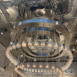 The Beautiful Chandelier Made of Upside Down Diptyque Candle Holders