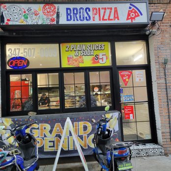 3 Bros Pizza - two scooters parked in front of a store - Pizza Near Me - Astoria, New York 3 Bros Pizza - two scooters parked in front of a store - Pizza Near Me - Astoria, New York