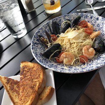 Pumpernickels - Garlic Parmesan toast with shrimp and mussels tossed in white wine butter with Angel hair pasta - American Near Me - Saugatuck, Michigan Pumpernickels - Garlic Parmesan toast with shrimp and mussels tossed in white wine butter with Angel hair pasta - American Near Me - Saugatuck, Michigan