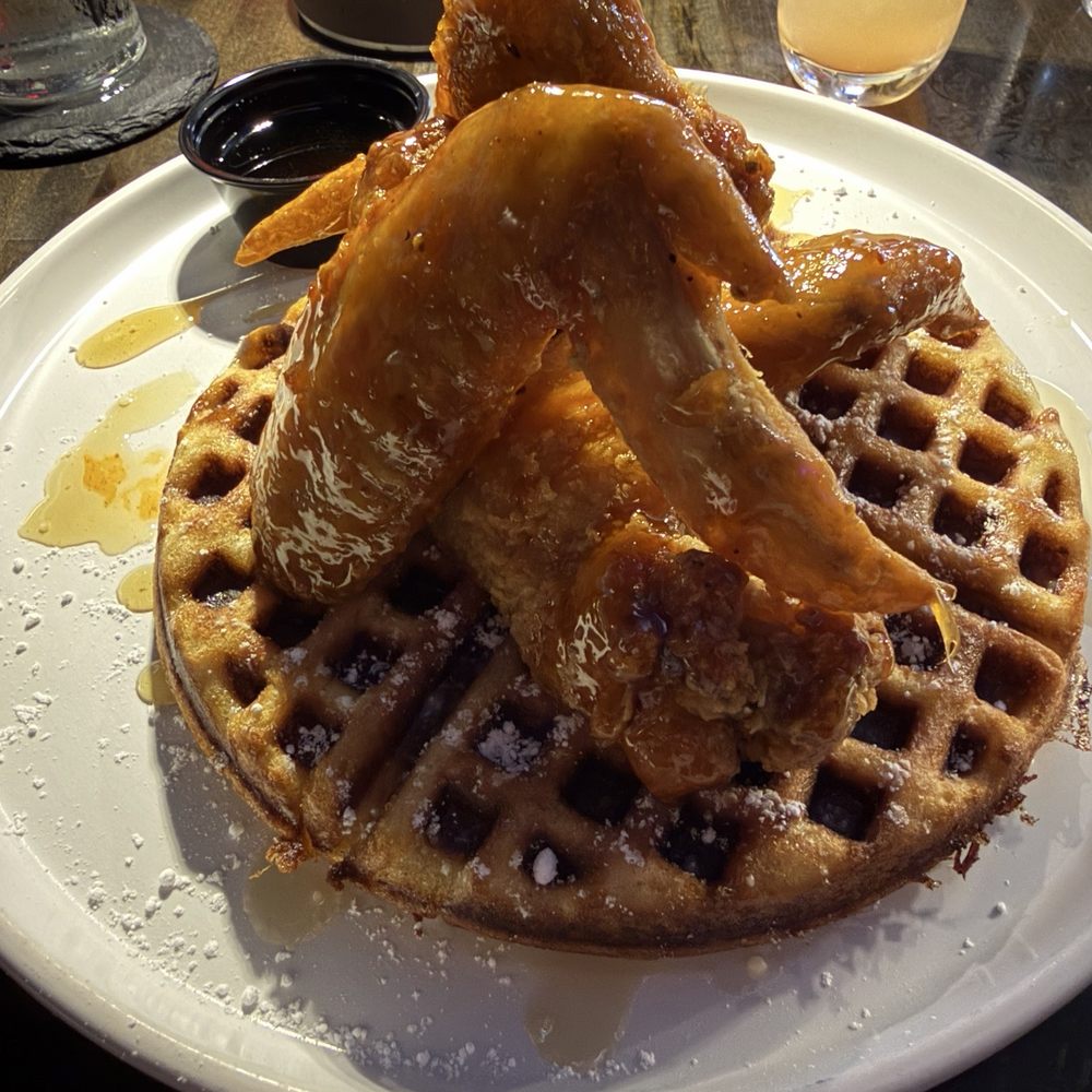 Victory East - Chicken tossed in honey hot sauce (great flavor) and waffle (a little too dry for my liking) - Chicken Wings Near Me - Austin, Texas Victory East - Chicken tossed in honey hot sauce (great flavor) and waffle (a little too dry for my liking) - Chicken Wings Near Me - Austin, Texas