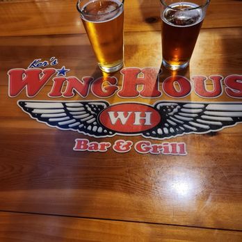WingHouse Bar & Grill - two pints of beer - Sports Bars Near Me - Pinellas Park, Florida