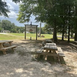 The Catfish Shack - Seating out front under the oaks