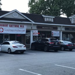 cars parked in front of a restaurant