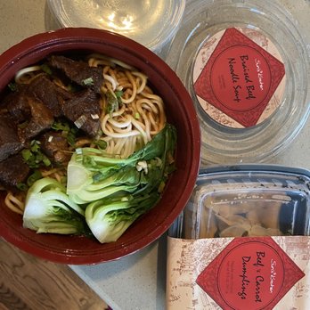 Sun's Kitchen - Braised beef noodle soup (broth there on the side so you add yourself for non soggy noodles) and carrot and beef dumplings. - Chinese Near Me - Charlotte, North Carolina Sun's Kitchen - Braised beef noodle soup (broth there on the side so you add yourself for non soggy noodles) and carrot and beef dumplings. - Chinese Near Me - Charlotte, North Carolina