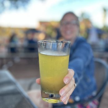 Celery City Craft - a woman holding a glass of beer - Bars Near Me - Sanford, Florida Celery City Craft - a woman holding a glass of beer - Bars Near Me - Sanford, Florida